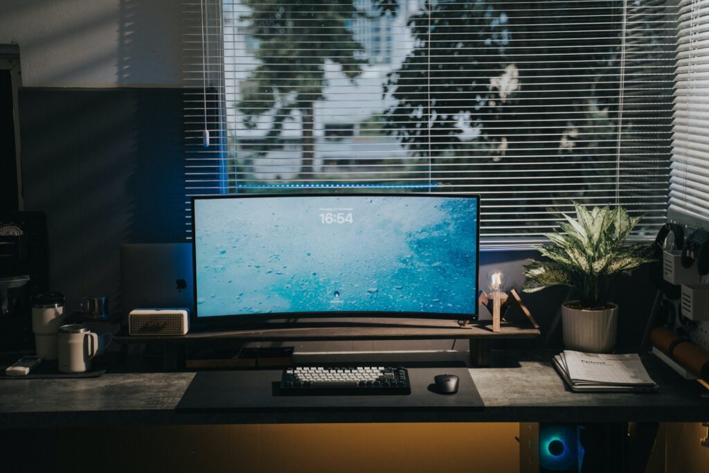 Home office setup with desk and computer near a window