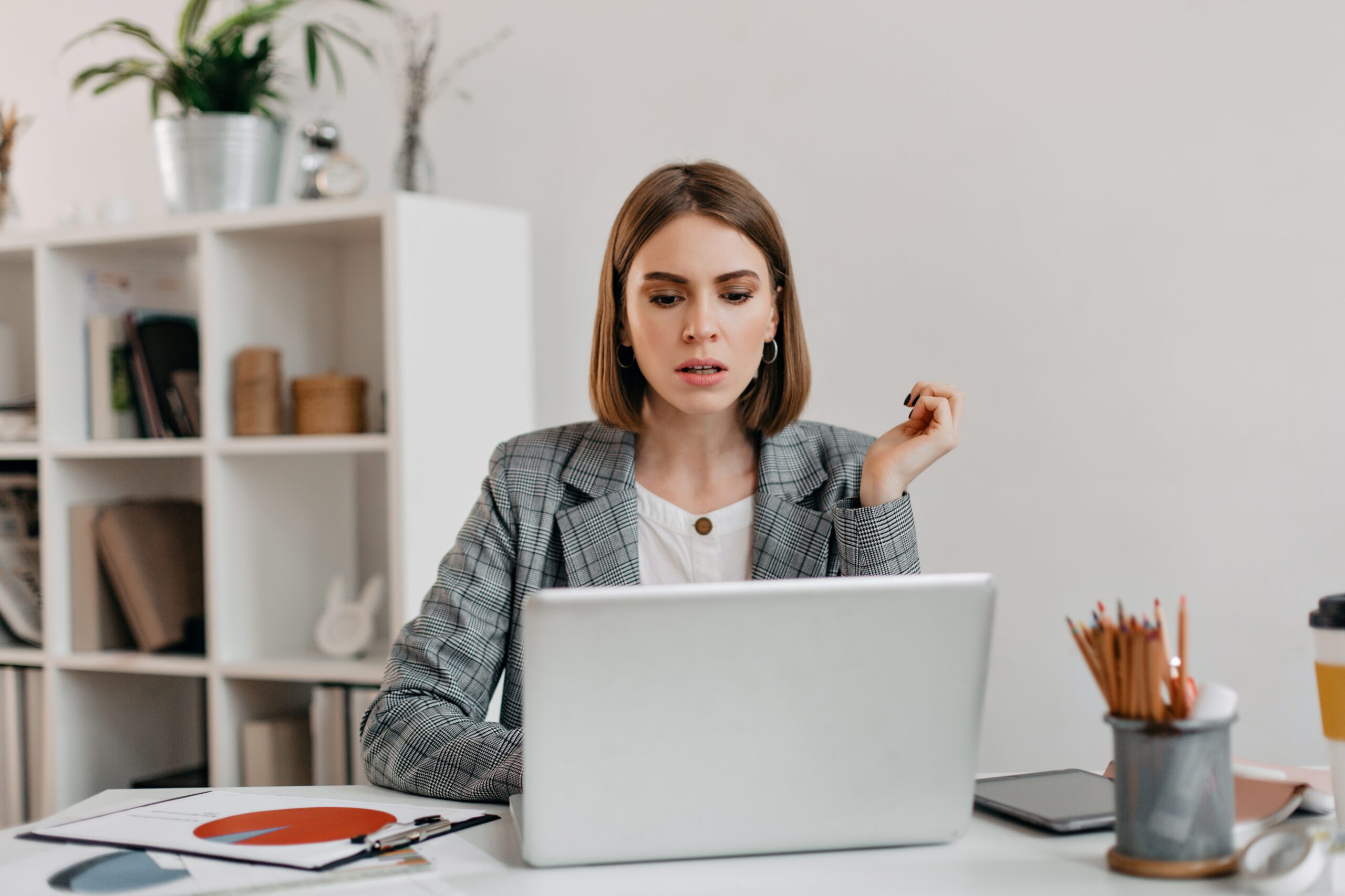 Woman frustrated with her macbook trying to reset the password