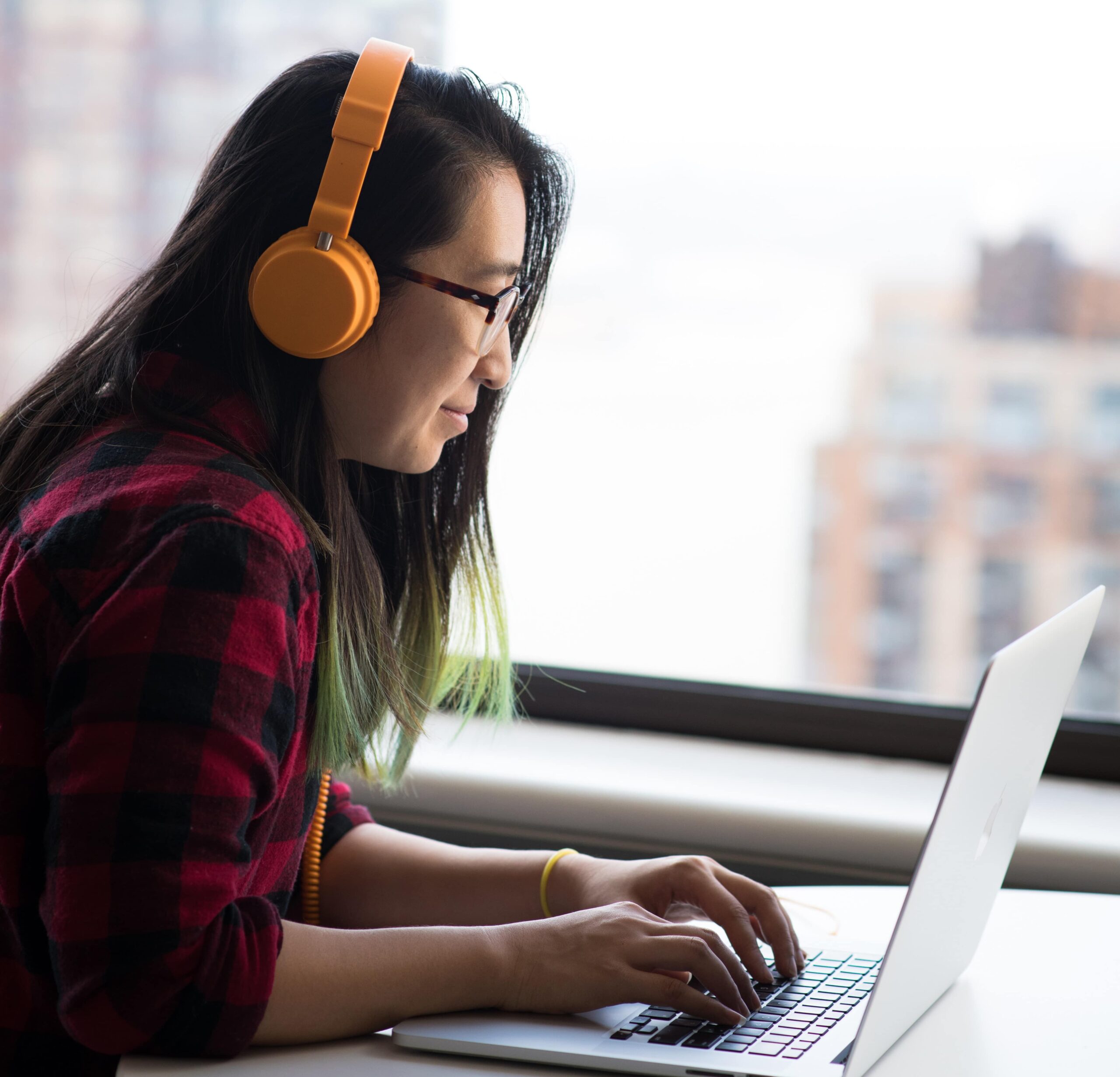 Young woman receiving online computer help